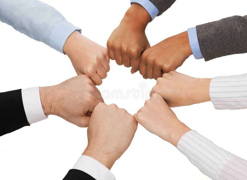 Closeup of businesspeople hands in fists in circle royalty free stock photo Closeup of businesspeople hands in fists in circle royalty free stock photo