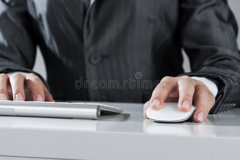 Closeup of businesswoman hand typing on keyboard with mouse on w royalty free stock photo Closeup of businesswoman hand typing on keyboard with mouse on w royalty free stock photo