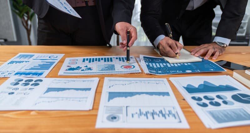 Closeup busy analyst team discussing financial data on laptop. Fervent. Closeup busy analyst team discussing financial data on digital dashboard, analyzing chart and graph using data science software display on a laptop screen. Business intelligence and Fintech.