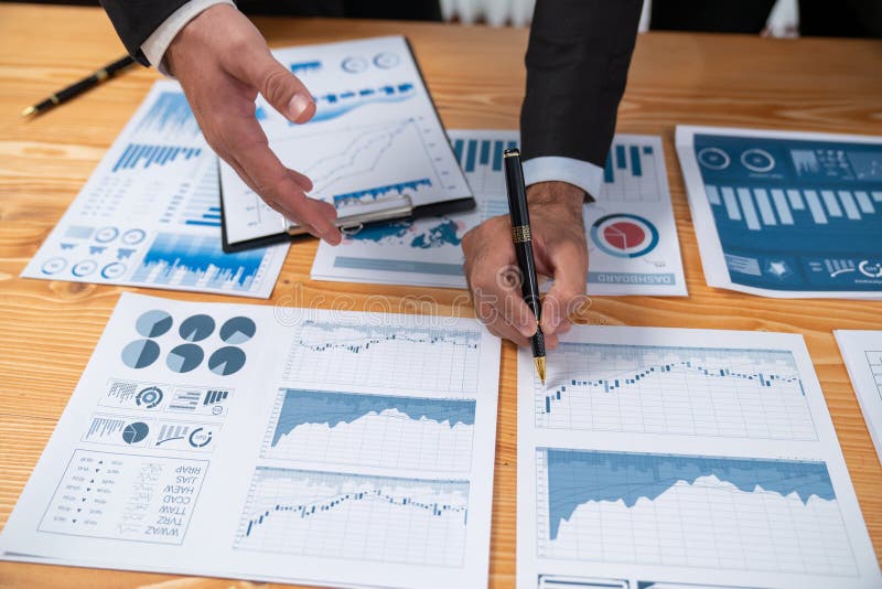 Closeup busy analyst team discussing financial data on laptop. Fervent royalty free stock photo