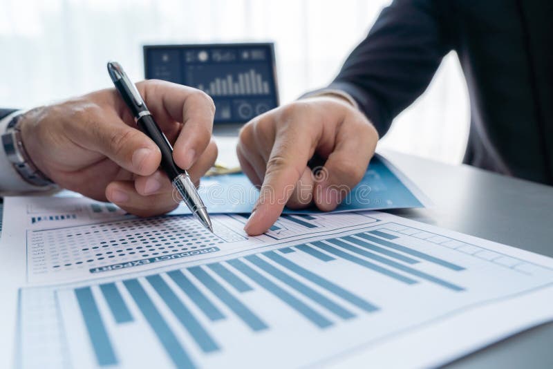 Closeup busy analyst team discussing financial data on laptop. Fervent stock photography