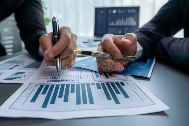 Closeup busy analyst team discussing financial data on laptop. Fervent royalty free stock photo