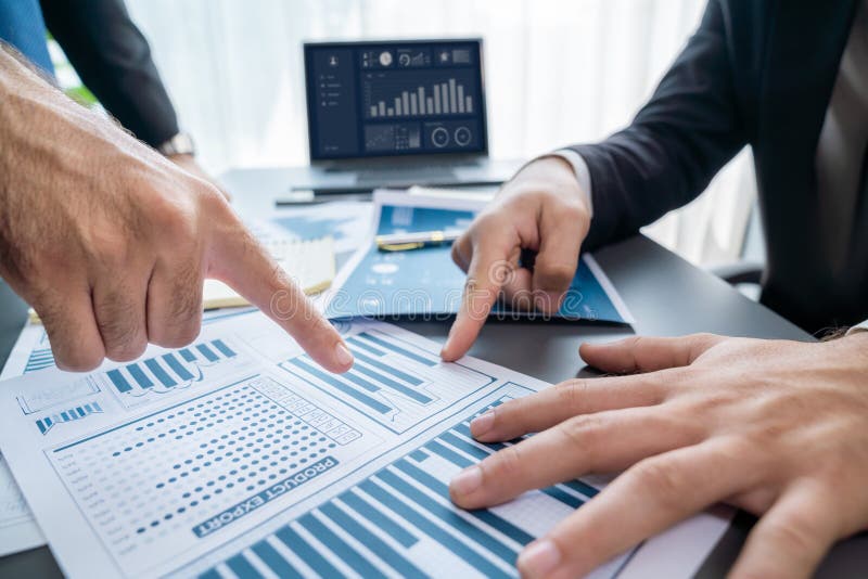 Closeup busy analyst team discussing financial data on laptop. Fervent stock images