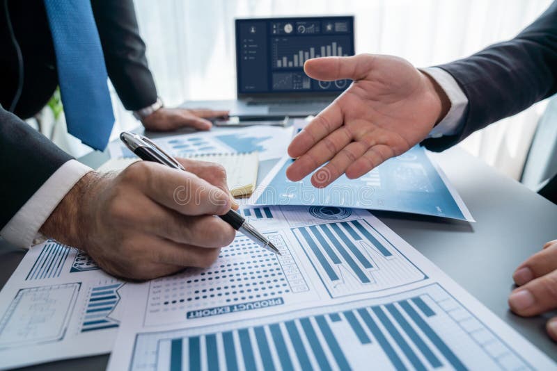 Closeup busy analyst team discussing financial data on laptop. Fervent stock photos