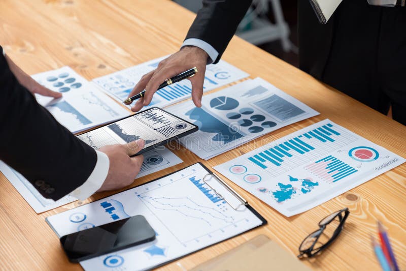 Closeup busy analyst team discussing financial data on laptop. Fervent. Closeup busy analyst team discussing financial data on digital dashboard, analyzing chart and graph using data science software display on a laptop screen. Business intelligence and Fintech.
