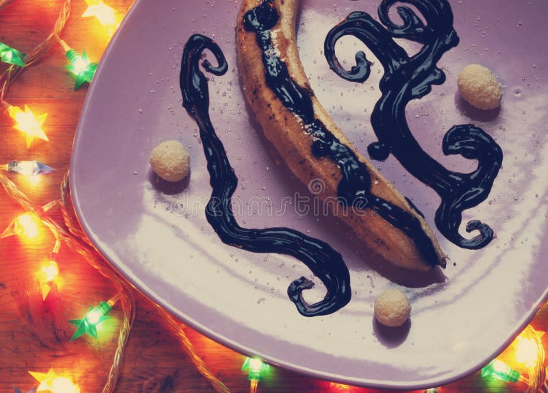 Closeup of caramelized banana and chocolate syrup stock photos Closeup of caramelized banana and chocolate syrup stock photos