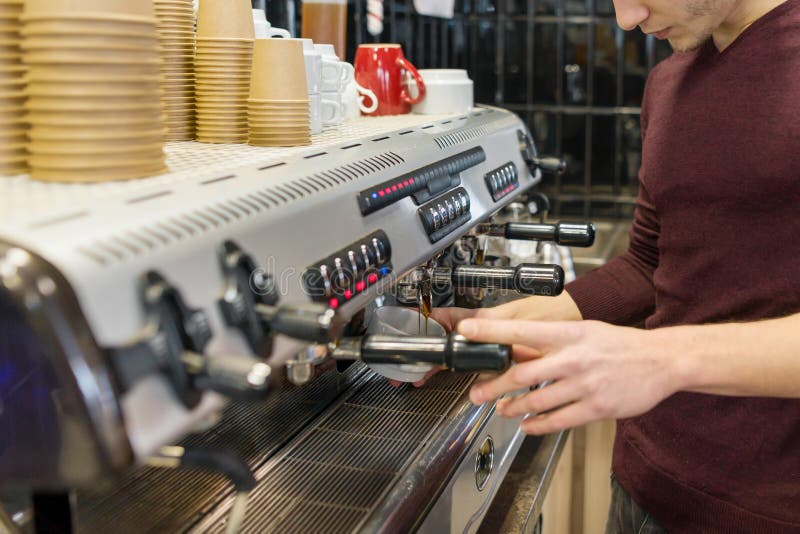 Closeup of Coffee Making Process, Hands of Barista Using a Coffee