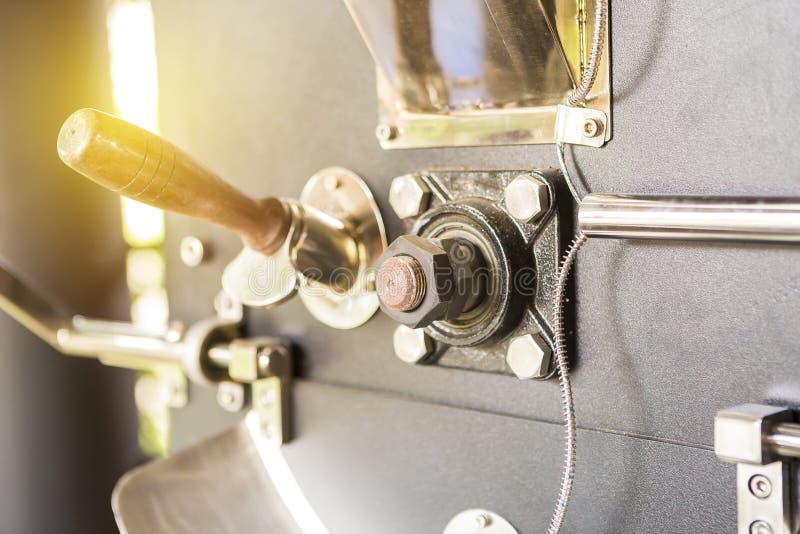 Closeup Coffee Roaster Machine with Vintage Warm Light Stock Photo