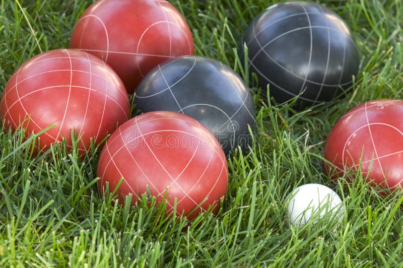 Closeup of Colourful Bocce Balls on the Lawn Under the Sunlight Stock