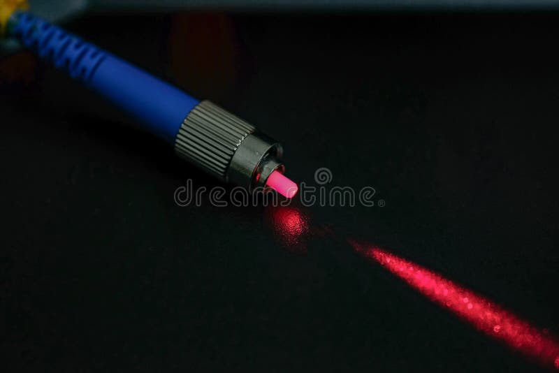 Closeup of Connectors of Optical Fiber Network Cable. the Laser Shines
