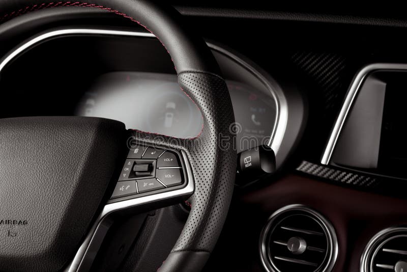 Closeup of the Controls on the Steering Wheel of a New SUV Stock Photo