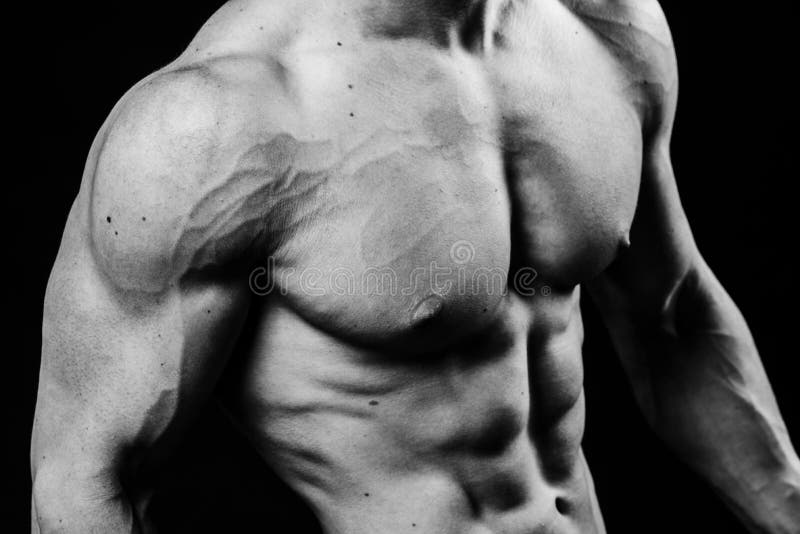 Closeup of cool perfect strong sensual bare torso with abs pectorals 6 pack muscles chest black and white studio