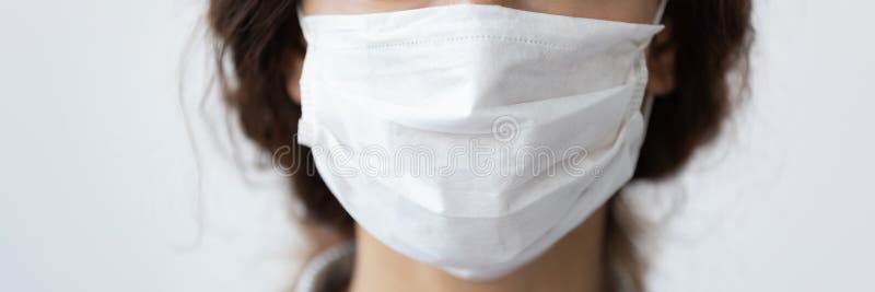 Closeup cropped horizontal image woman wear mask on blue background royalty free stock photography Closeup cropped horizontal image woman wear mask on blue background royalty free stock photography