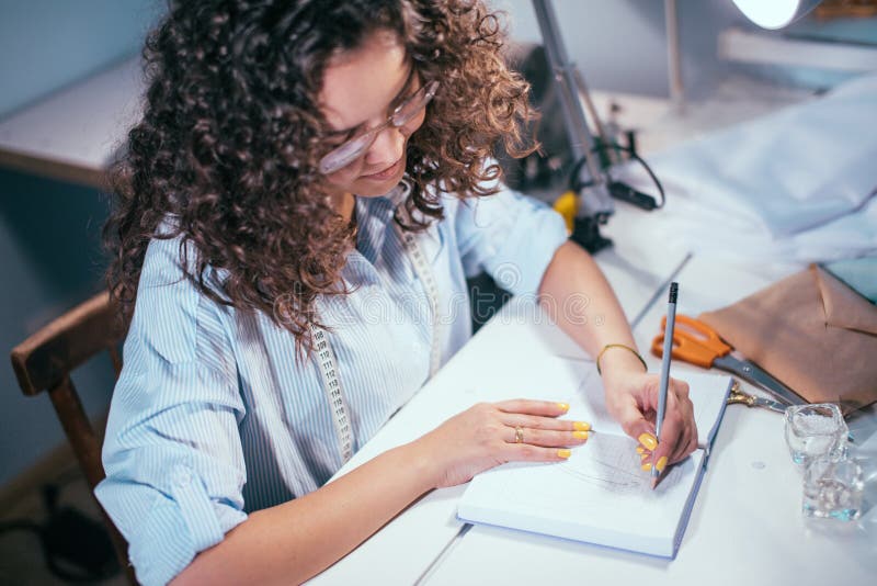 Closeup Cropped Side View Photo of Seamstress Writing Notes in Diary ...