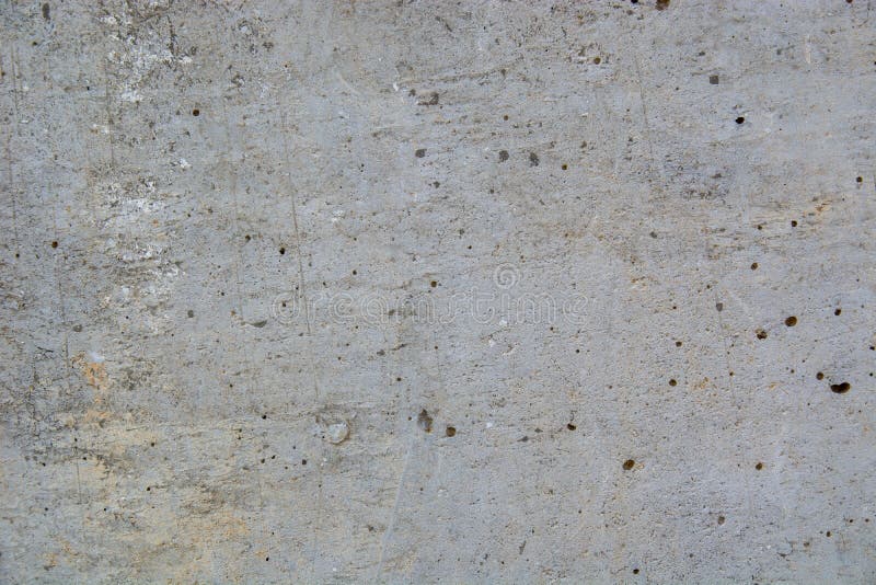 Closeup of a Damaged Grungy Marble Wall with Small Holes Stock Image