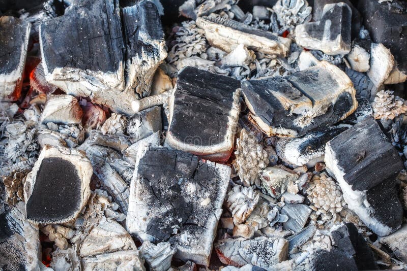 Closeup of decaying wood coals and ash in brazier