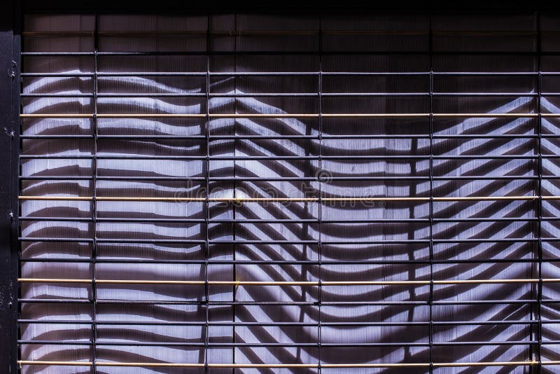 Closeup details of old industrial architecture create light pattern abstract