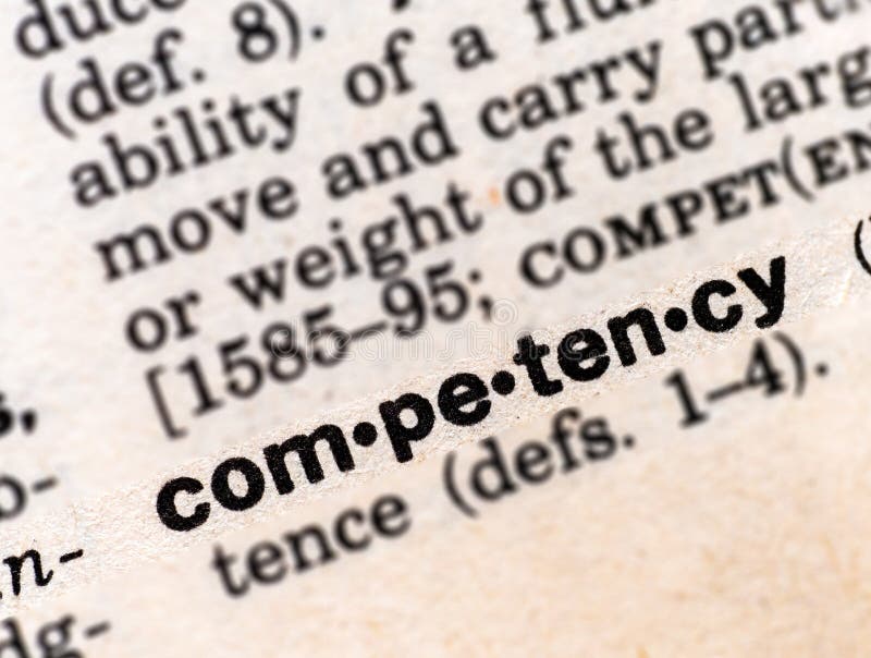 Closeup of the dictionary definition of the word competency royalty free stock photos