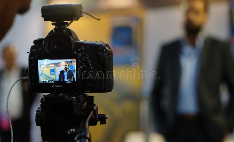Display or monitor of DSLR camera shooting video interview in a trade show