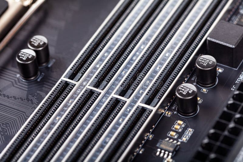 Closeup on empty RAM slots on a modern black silver motherboard. Ddr4, ddr5 random access memory stick slots, ram placing order royalty free stock photo