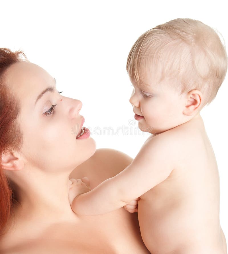 Closeup faces of happy mother with cute baby girl