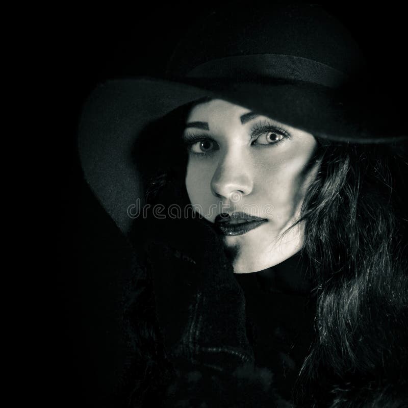 Closeup fashionable portrait of beautiful, pretty girl in black hat stock photo Closeup fashionable portrait of beautiful, pretty girl in black hat stock photo