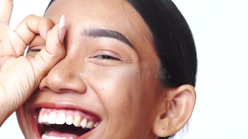 Closeup female eye doing circle, binocular with hand - video in slow motion