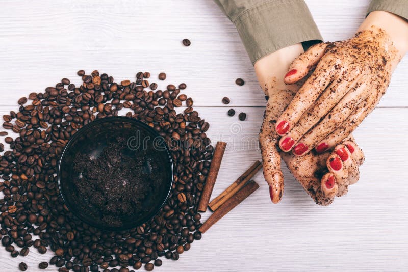 Closeup of female hands and the coffee scrub