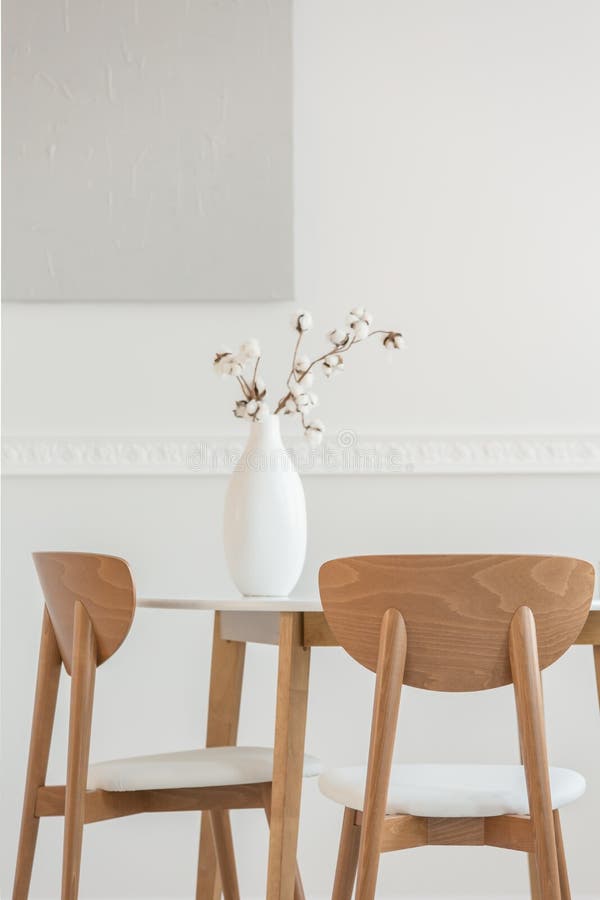 Closeup of Flowers in White Vase on Dining Table with Chairs Stock Image Image of apartment