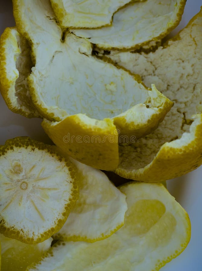 A closeup of fresh lemon peels inside out in a macro shoot