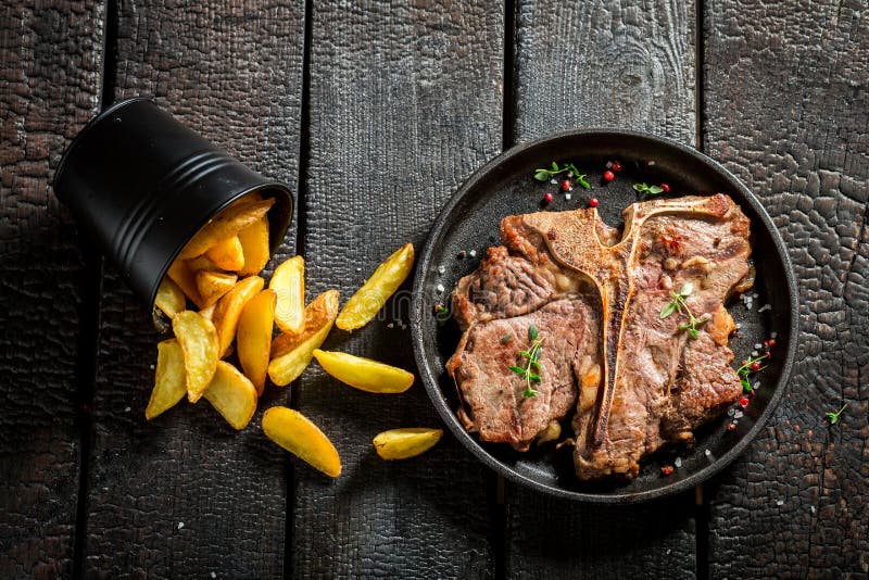 Closeup of Fresh Tbone Steak and Chips with Herbs Stock Image Image of beefsteak, potato 94051447