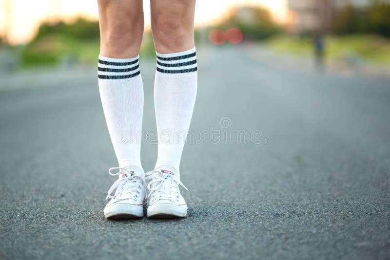 Close Up Girl Legs In White Stockings Stand Alone On