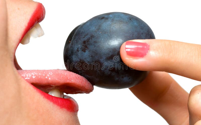 Closeup of girl s mouth and plum