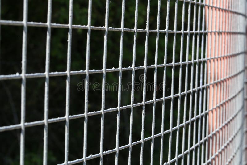 Closeup of grey mesh fence stock image. Image of cage 117388933