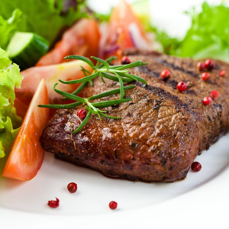 Closeup of grilled steak with vegetables