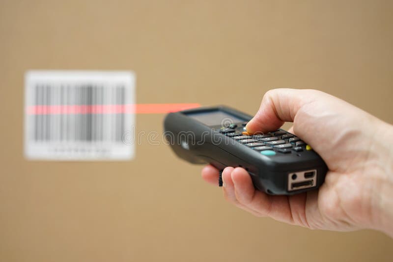 Closeup of hand holding bar code scanner stock photo Closeup of hand holding bar code scanner stock photo