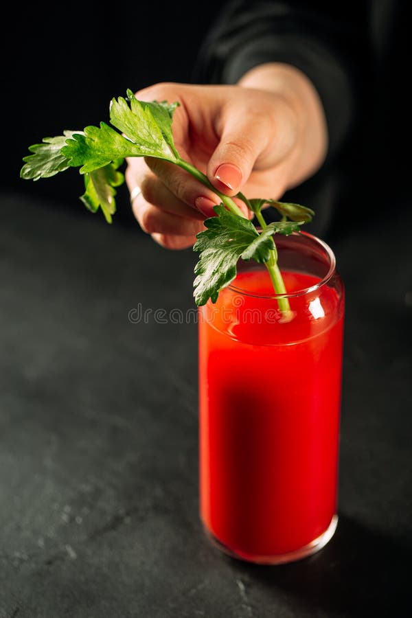 Hand Making Bloody Mary Cocktail with Celery Stock Image Image of