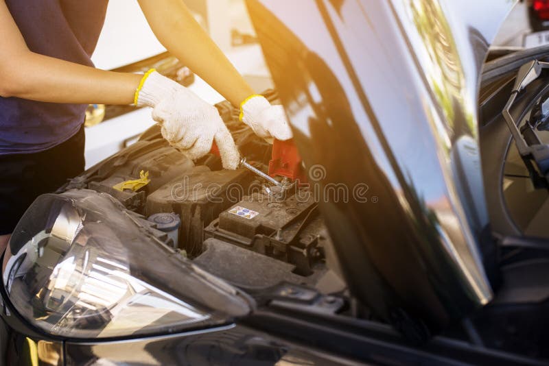 Closeup of hand mechanic engineer fixing car battery at garage,concept car maintenance. Closeup machine tool stock images, royalty-free photos and pictures