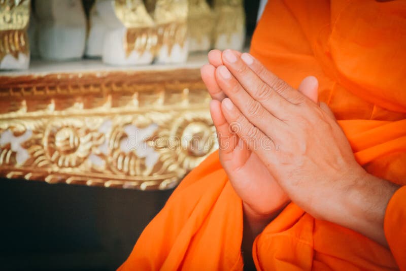 Closeup Hand Pray of Thai Monk. stock photo