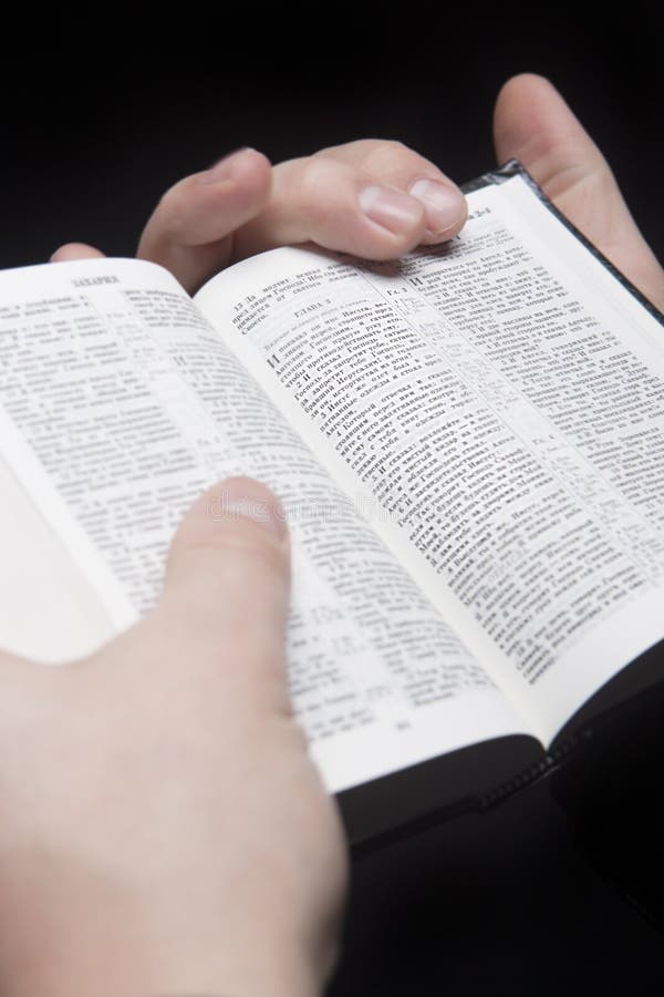 Closeup of the Hands of a Man Holding Bible Stock Image - Image of ...