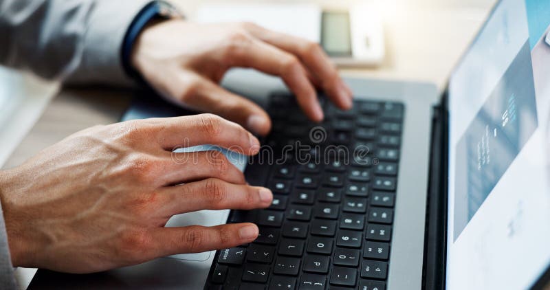Closeup, hands typing and a laptop for work, email or web design. Connection, office and a corporate employee working on stock photography