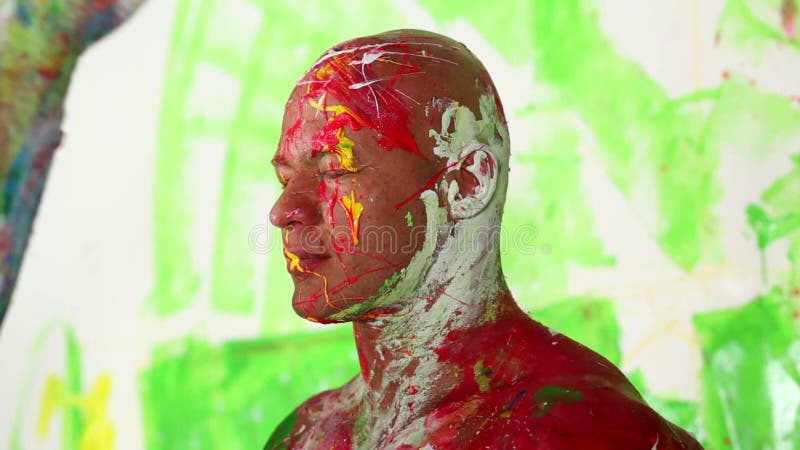 Closeup head of bald man painted and splashed by stock video