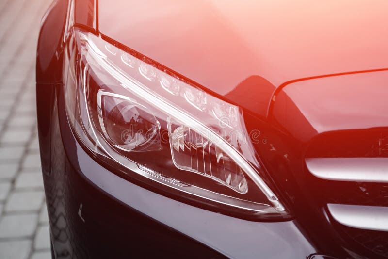Headlight of Red Luxury Sport Car. Stock Photo Image of headlight