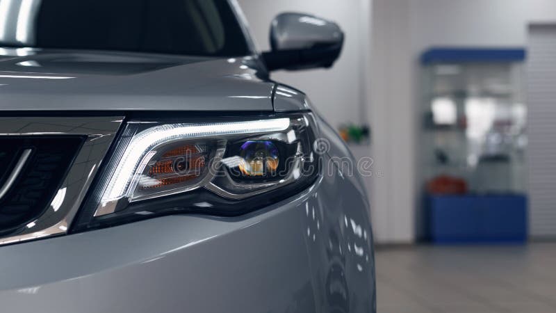 Closeup headlights of a modern white color car. Detail on the front light of a car