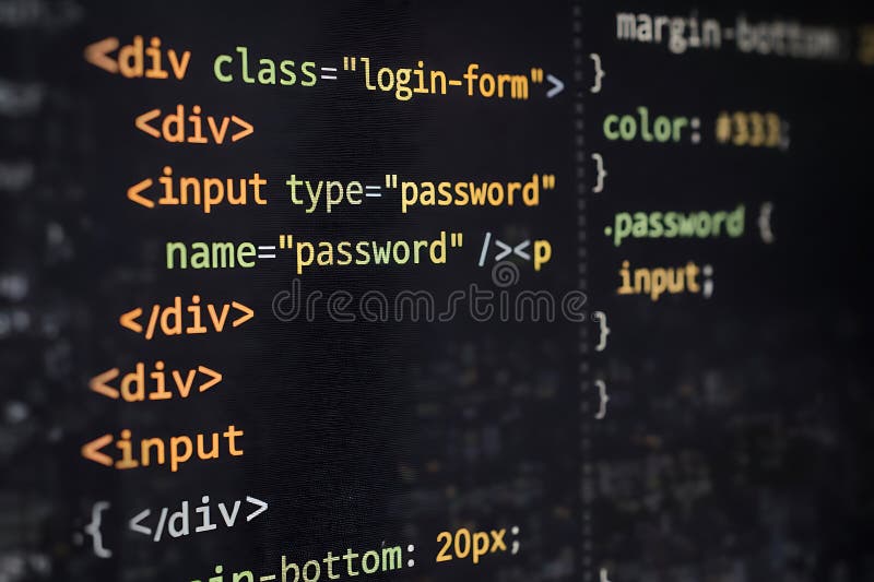 Closeup of HTML and CSS code on computer screen for web development on dark background. Css code illustrations