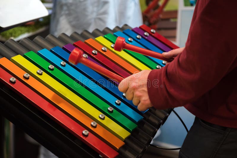 Closeup humans hands playing vibraphone. Favourite classical music. Music classes, learning how to play musical instrument