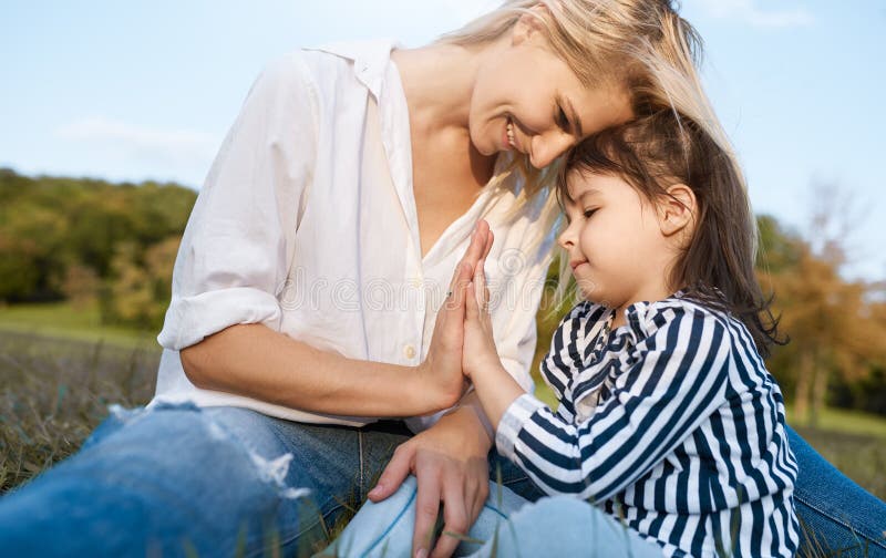 Closeup image of cute little girl playing with her smiling happy mother. Loving beautiful woman and her daughter spending time stock photos Closeup image of cute little girl playing with her smiling happy mother. Loving beautiful woman and her daughter spending time stock photos