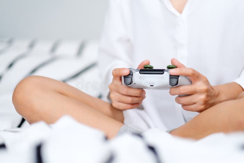 Free Photo  Person playing video games with controller on