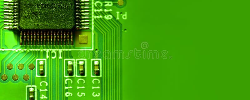Closeup of Integrated Electronic Circuit in a Bright Green Light Stock