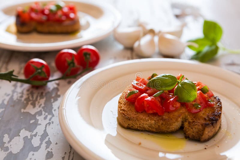 Closeup of Italian bruschetta with tomato and basil stock images Closeup of Italian bruschetta with tomato and basil stock images